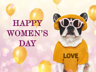 Happy Women's Day. Cute puppy, flower and congratulatory inscription. Close-up, indoors, studio shot. Congratulations for family, loved ones, relatives, friends and colleagues. Pets care concept