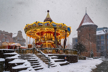 Shiny horse carousel in winter Gdansk