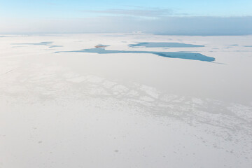 Frozen lake view from a drone. Winter landscape.