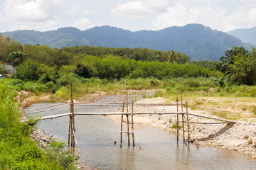 Bamboo bridge built across the river