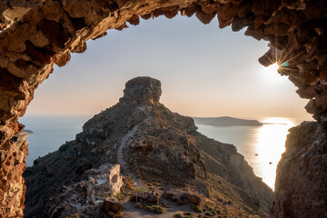 Obraz premium View of Skaros Rock through a natural stone archway, Santorini
