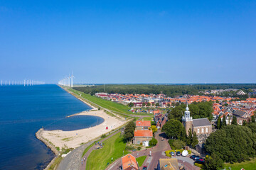 Drone photo of the former Zuiderzee island of Urk with windmills in the background in the Netherlands