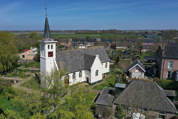 White church in the northern Dutch village of Hauwert in the Netherlands. Photo taken with a drone.