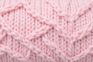 Seamless pastel pink knitted wool fabric texture close up