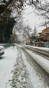 Quiet Residential Street During Snowfall in Bucharest
