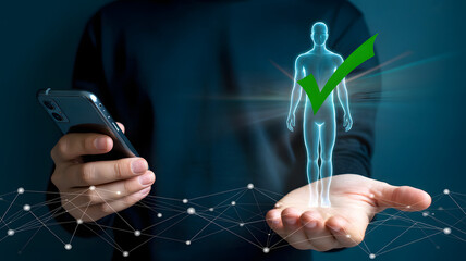 Businessperson holding smartphone and holographic human figure with green checkmark symbolizing identity verification