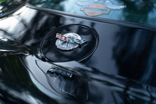 Classic corvette emblem shines under soft afternoon light