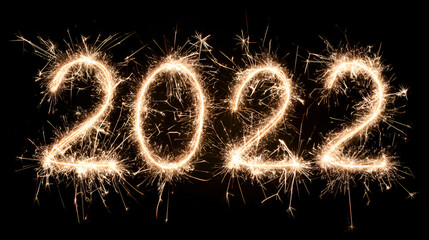 2022 New Year celebration sparkler number fireworks on black background glowing golden light