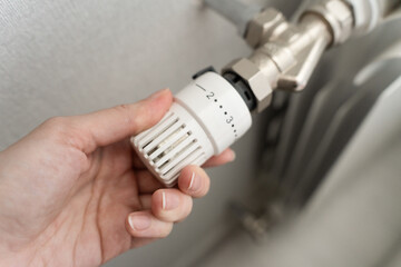 Radiator heating, concepts of heat and energy conservation and the importance of rational use of resources in the cold season. Turning on and off the heating.