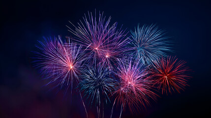 Vibrant fireworks exploding in night sky with colorful bursts
