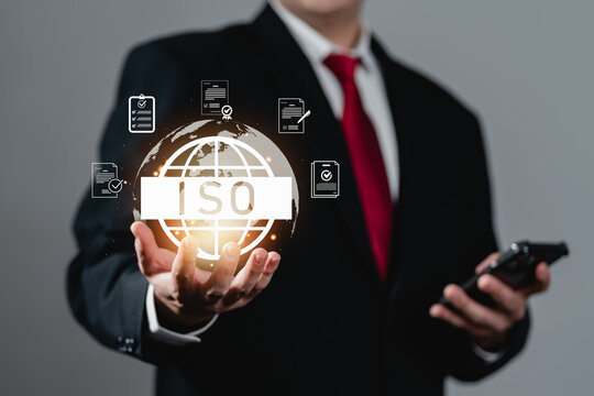 Quality assurance and ISO certification concept with businessman selecting digital checklist and document icons, representing compliance, standardization, audit process, and professional quality - Powered by Adobe