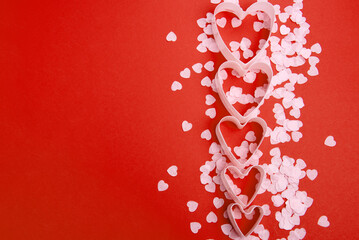 Beautiful and romantic valentines background with present and hearts in red for valentines day or anniversary holiday celebration with copy space