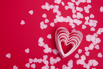 Beautiful and romantic valentines background with present and hearts in red for valentines day or anniversary holiday celebration with copy space