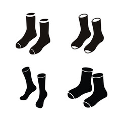 Collection of four pairs of plain black socks with white accents, ready for everyday wear
