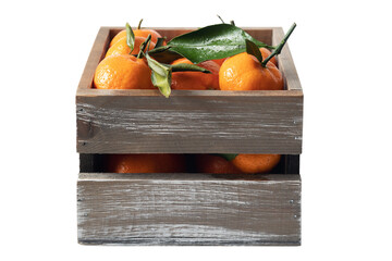 Fresh oranges in rustic wooden crate with green leaves on top