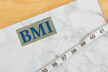 BMI body mass index health concept on digital scale with measuring tape