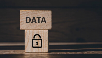 Wooden blocks with DATA and lock symbol represent digital security and data protection