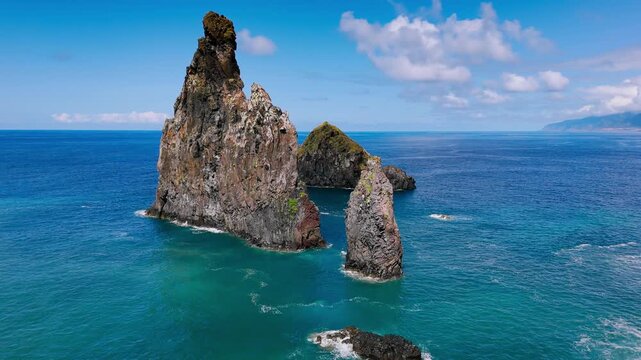 Drone view of isolated rock stacks rising from the Atlantic Ocean along the Madeira Island coastline