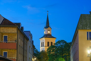 Tower of Vimmerby Kyrka evangelical church at dusk. Sweden