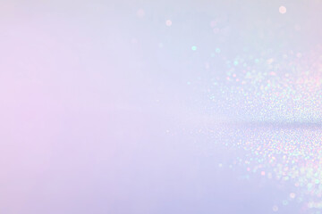 Iridescent glittery surface with bokeh on pastel background ideal for festive designs, greeting cards, backgrounds, and holiday themed projects.