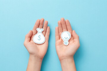 Hands holding money bag and light bulb icons, representing finance and innovation concepts, with a soft blue background enhancing the visual appeal and thematic relevance
