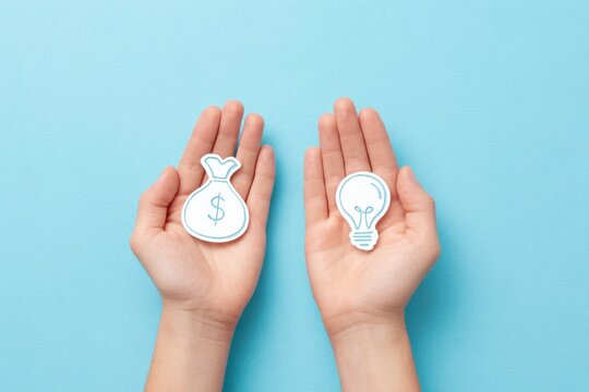 Hands holding money bag and light bulb icons, representing finance and innovation concepts, with a soft blue background enhancing the visual appeal and thematic relevance