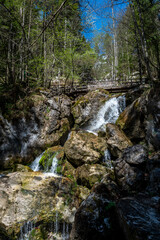 Hiking Trail With Wooden Bridge Over Waterfall Through Green Canyon At Myrafaelle In Austria