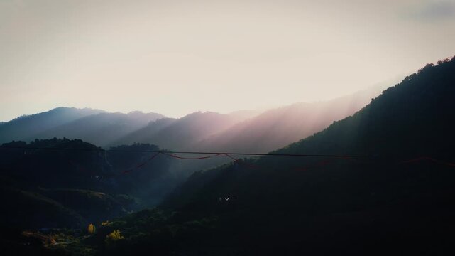 Balancing above the earth as the first light of dawn stretches across the horizon