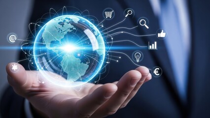 Businessman holding glowing digital globe with connected business icons.