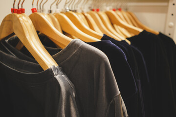 Clothes on clothes rail in clothing store