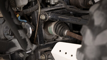 Old car suspensions. Close up car suspension wear and tear parts. CV joint Rubber boot and Control...