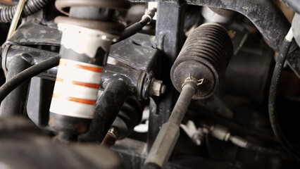 Old car suspensions. Close up car suspension wear and tear parts. CV joint Rubber boot and Control arms bushing Steering rack axles Shock absorber Brake exhaust. Gas Diesel car service repair parts.