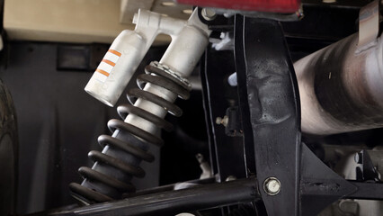 Old car suspensions. Close up car suspension wear and tear parts. CV joint Rubber boot and Control arms bushing Steering rack axles Shock absorber Brake exhaust. Gas Diesel car service repair parts.