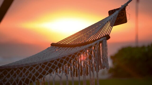 Close-up of a wicker hammock against the sun