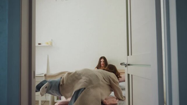 Caucasian Mother Enters Daughters Bedroom Quietly With Knitted Cardigan, Gentle Bedside CheckIn As Daughter Sits On Bed Reading, Soft Morning Light, Comforting Embrace And Warm Domestic Atmosphere,