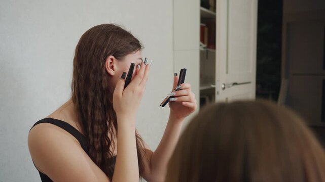 Woman Beautifies Herself, Caucasian Woman Applying Makeup, Calm Morning Routine Of Woman Preparing For Her Day, Soft Makeup Application By Woman In Bathroom During Peaceful Morning Moment