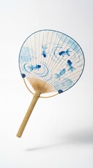 Japanese round fan with goldfish pattern floating on white background  