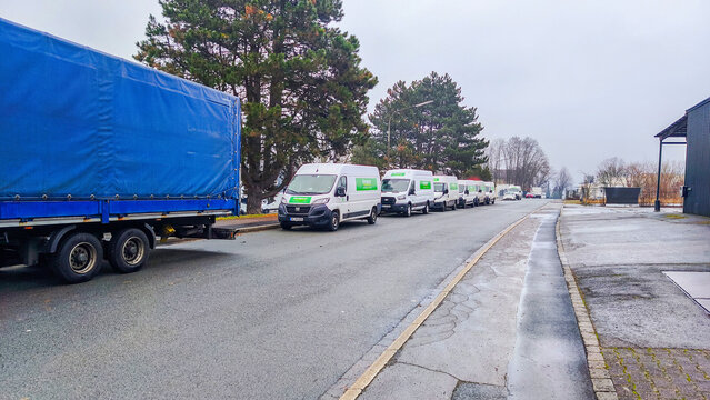 ISERLOHN, GERMANY &mdash; DECEMBER 29 2025: multiple Europcar rental cars parked along city street highlighting car sharing, mobility services, and urban transportation