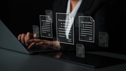 Business professional reviewing legal documents with digital interface showcasing terms and conditions on laptop and tablet in modern workspace Gluon.