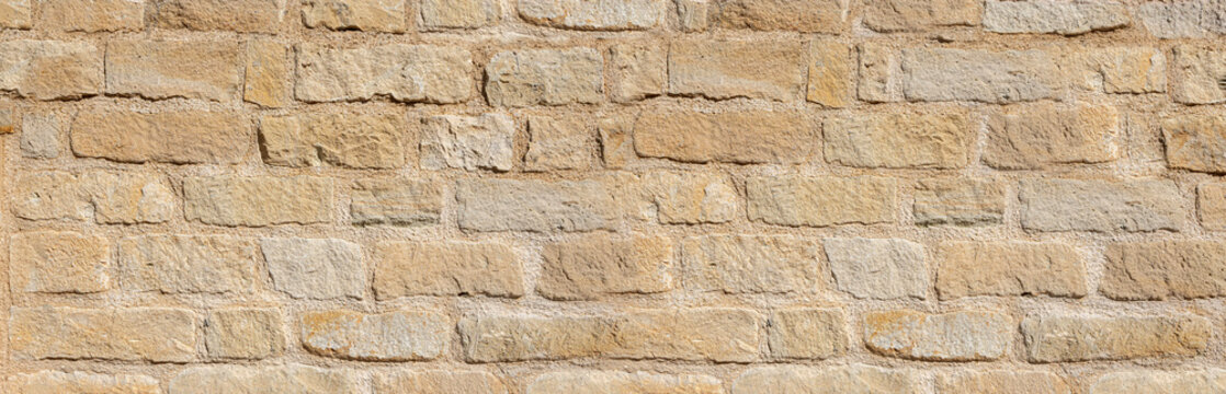 Old dry stone wall texture background showing masonry pattern