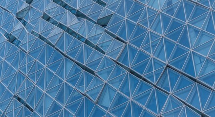 Obraz premium Modern blue glass building facade with geometric pattern