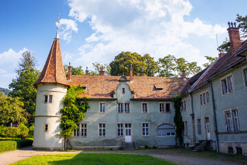 chynadiievo, transcarpathia, ukraine - 28 jul, 2013: schonborn royal palace under blue sky. heritage site in carpathians. popular tourist destination. hunting castle now a sanatorium on sunny day