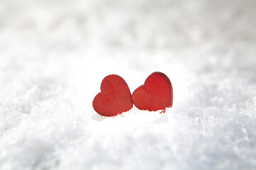 Fototapeta premium two red hearts on a snow