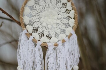 Dream catcher in winter outdoor season snow mascot bohemian style ethnic object hanging on the tree nature cozy calm photo beautiful background lifestyle thing boho lovely craft dreamcatcher 