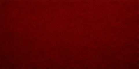 Vintage red grunge paper texture with a dark patterned design on a blank weathered surface creates a retro fabric and leather material backdrop for Christmas wallpaper