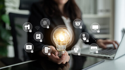 A businesswoman engages with innovative ideas, holding a light bulb amidst smart home icons, symbolizing security and technology in a modern office setting. Gantry