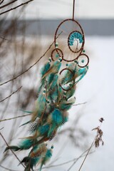 Dream catcher in winter outdoor season snow mascot bohemian style ethnic object hanging on the tree nature cozy calm photo beautiful background lifestyle thing boho lovely craft dreamcatcher