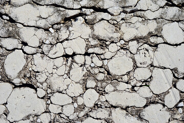 Large cracks in the concrete slab from time to time.