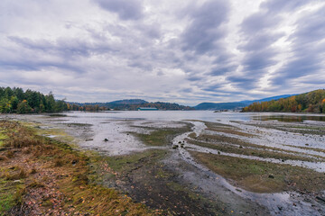 Low tide at Burrard Inlet on a cloudy winter day as viewed from Shoreline Trail at Port Moody, BC.