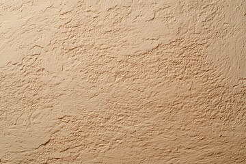 Soft and textured dusty beige surface showing subtle variations in tone and a delicate, chalky, almost powdery tactile quality under soft light